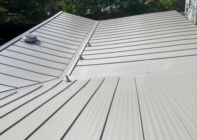 Solar attic fan installed on a metal roof for Roof Ventilation in Ashland City